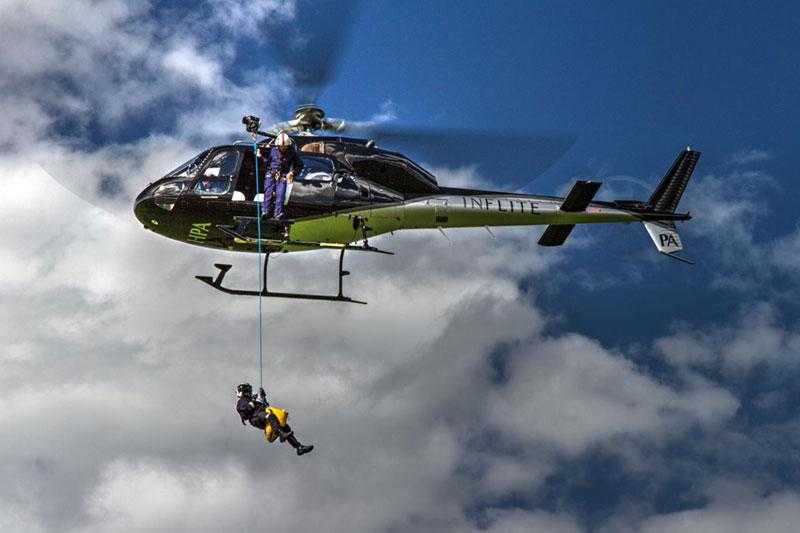 One person suspended on a rope connected to the Inflite Helicopter.