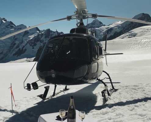 Inflite helicopter with picnic setup on the glacier