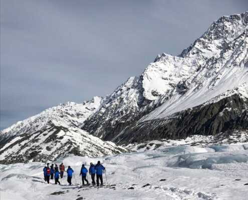 A group snowshoeing in Mount Cook