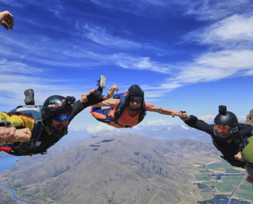 Six people midair on a sports skydive in Mt. Cook.