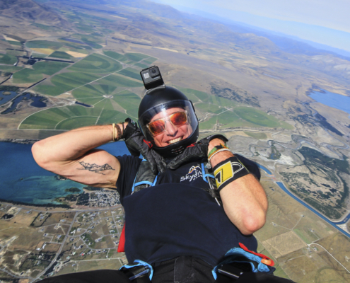Man with a scenic view of Mt. Cook while on sports skydive.